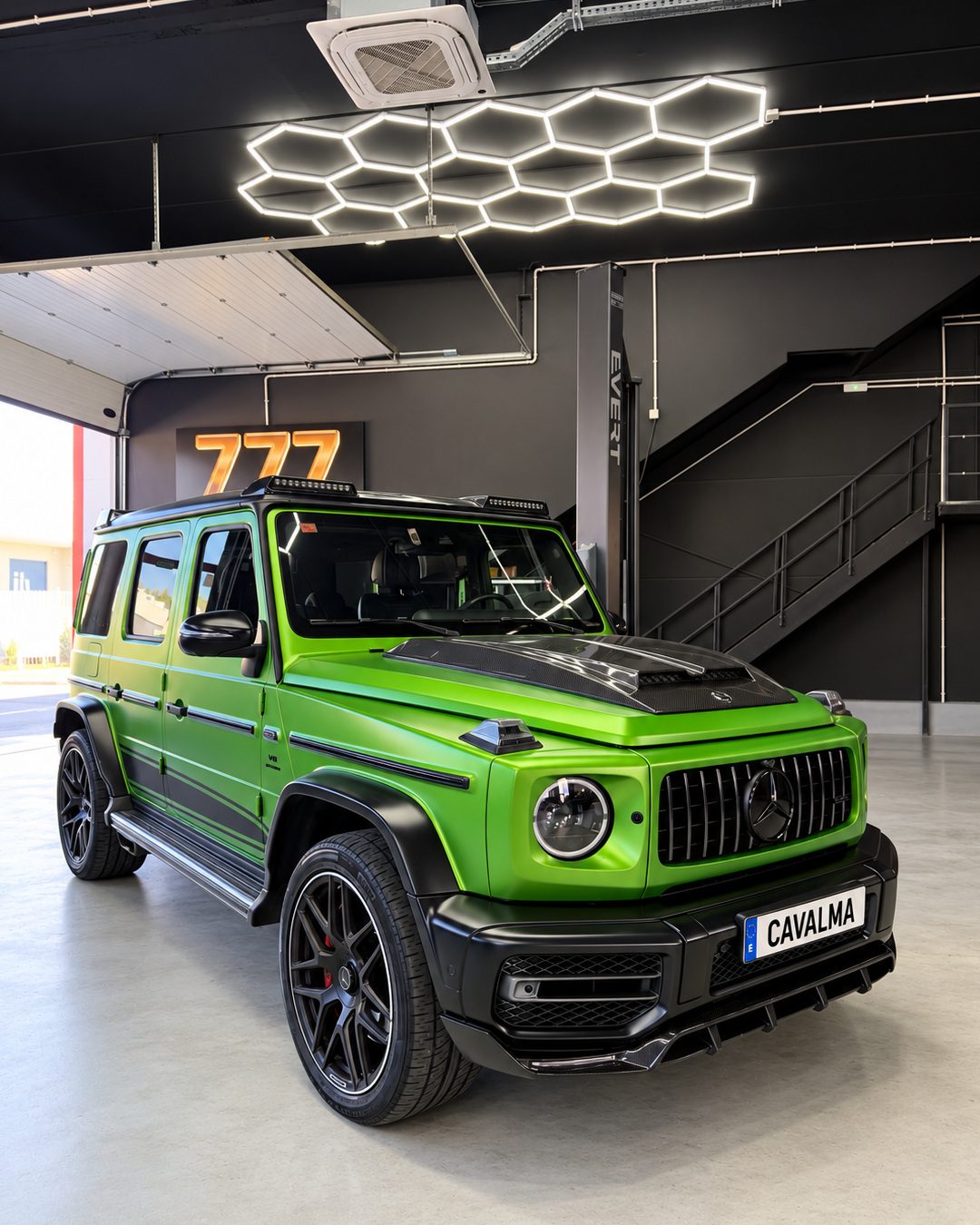 Mercedes-Benz G63 - Front three-quarter view of a bright green Mercedes-Benz G63 with a black grille, dark alloy wheels and front bumper detailing.