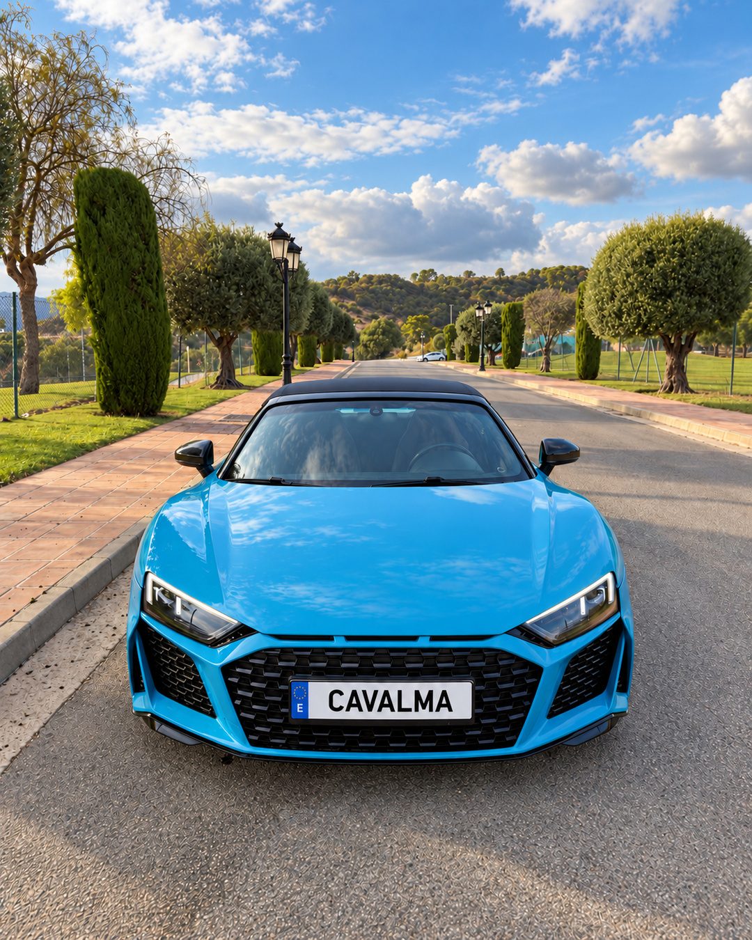 Front view of a blue Audi R8 Spyder available for luxury sports car rental in Marbella through CAVALMA.