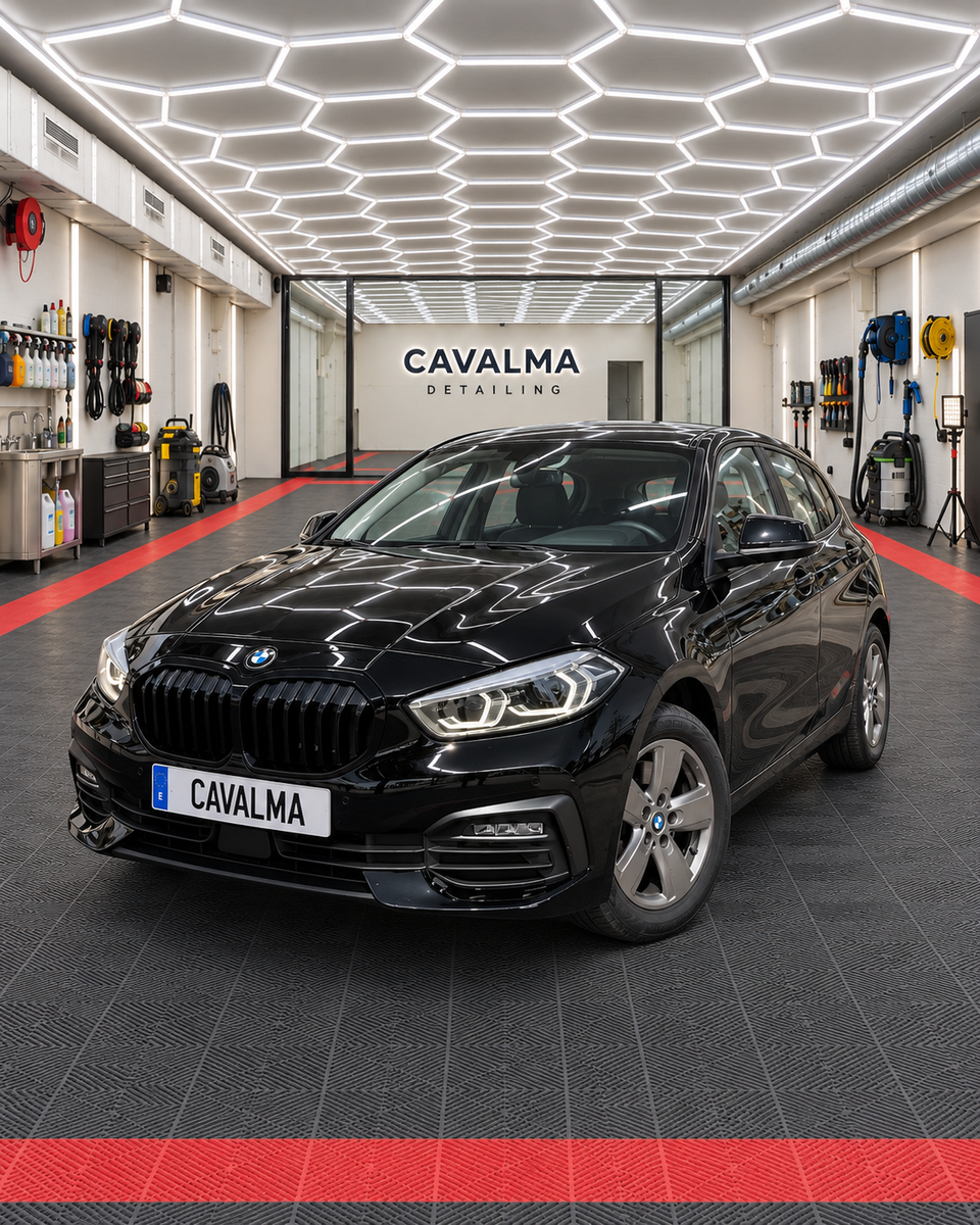 Black BMW 1 Series hatchback viewed from the opposite front three-quarter angle, highlighting its sculpted bonnet, front bumper, headlights and dark exterior finish.